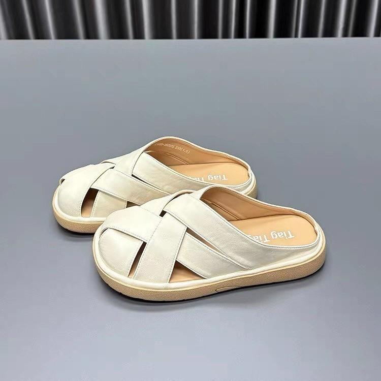 Woven French bag head slippers women's 2025 summer new flat bottom hollow fashion high sense with skirt cool slippers
