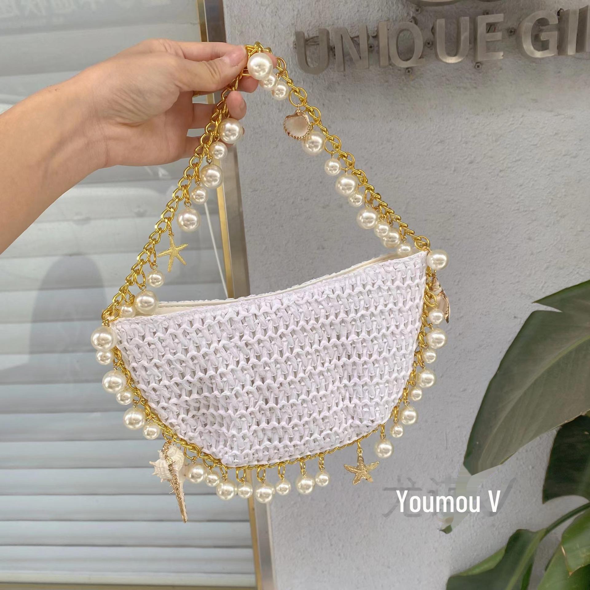 

Пляжна сумка-тоут з ручної роботи з плетеної соломи у формі зірки та мушлі