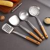 Stainless Steel Cookware Set: Spatula, Soup Ladle, Slotted Spoon with Orange-Brown Wood Handle.