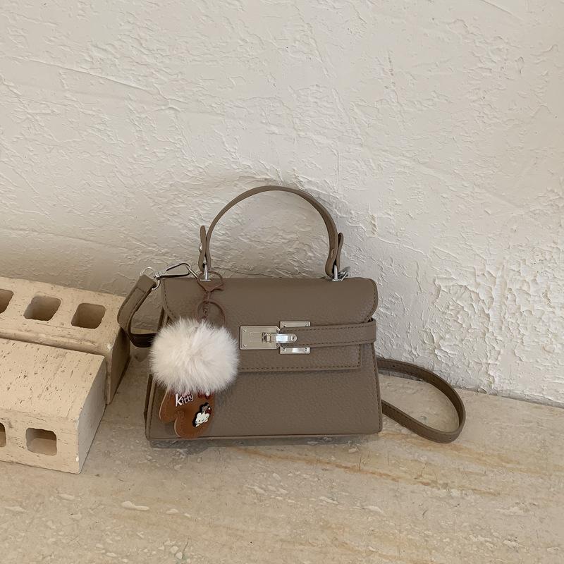 Elegant Commuting Bag for Work with A Chic Kelly Bag Style, Single-shoulder Cross-body Design.