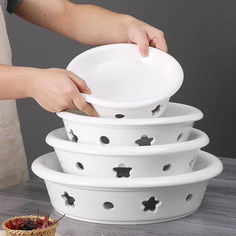 Ceramic Egg-Shaped Plum Blossom Grilled Fish and Warming Plate with White Round Heating Dry Pot Stove.