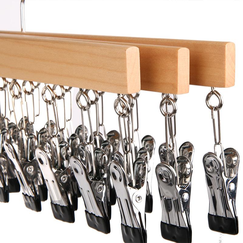 A Portable Space Saving Tool for Storing Hats, Underwear, and Scarves Using Wooden Hangers with Multiple Clips for Household Use