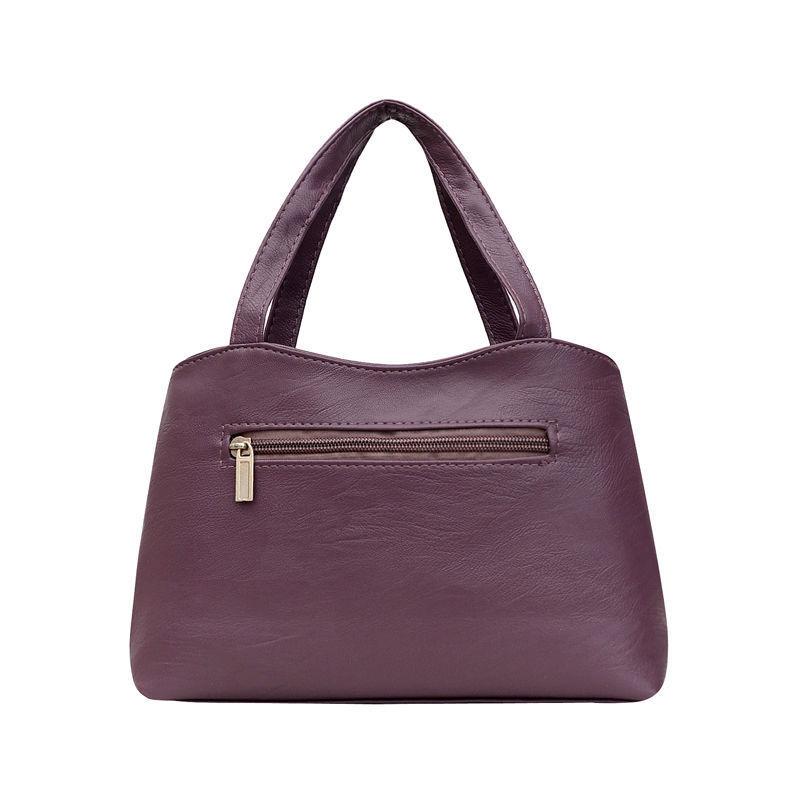 A Lady Commutes To and From Work with Her Mother's Bag In Hand