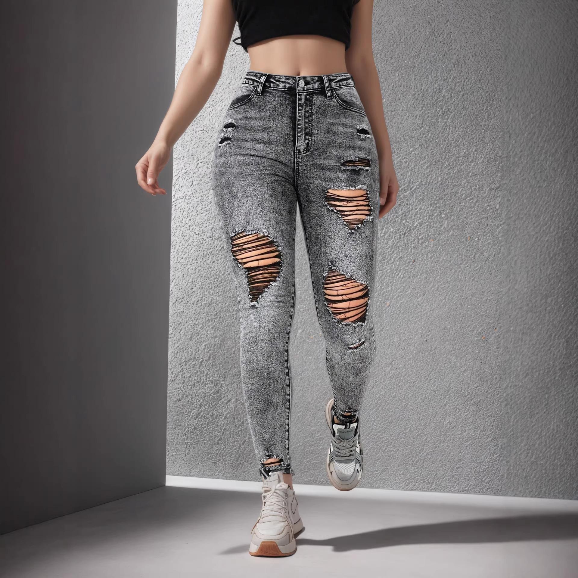 High-street fashion: unique ripped women’s stretch slim-fit skinny jeans – the latest trend XS темно-серого