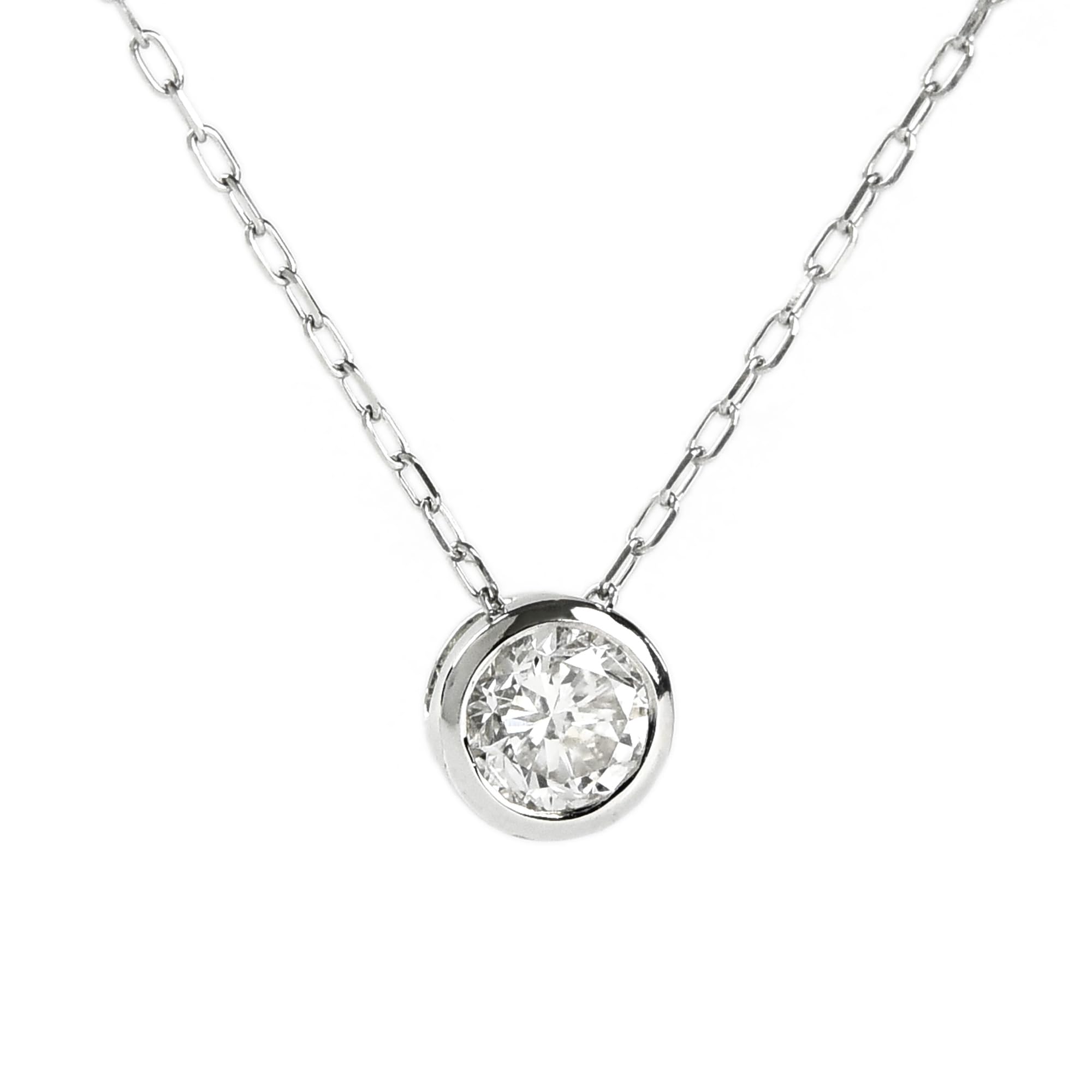 

Nude Solitaire Diamond Necklace in 18k Gold with a Carat Diamond This simple pendant features a carat solitaire diamond and is crafted from 18k This платиновий