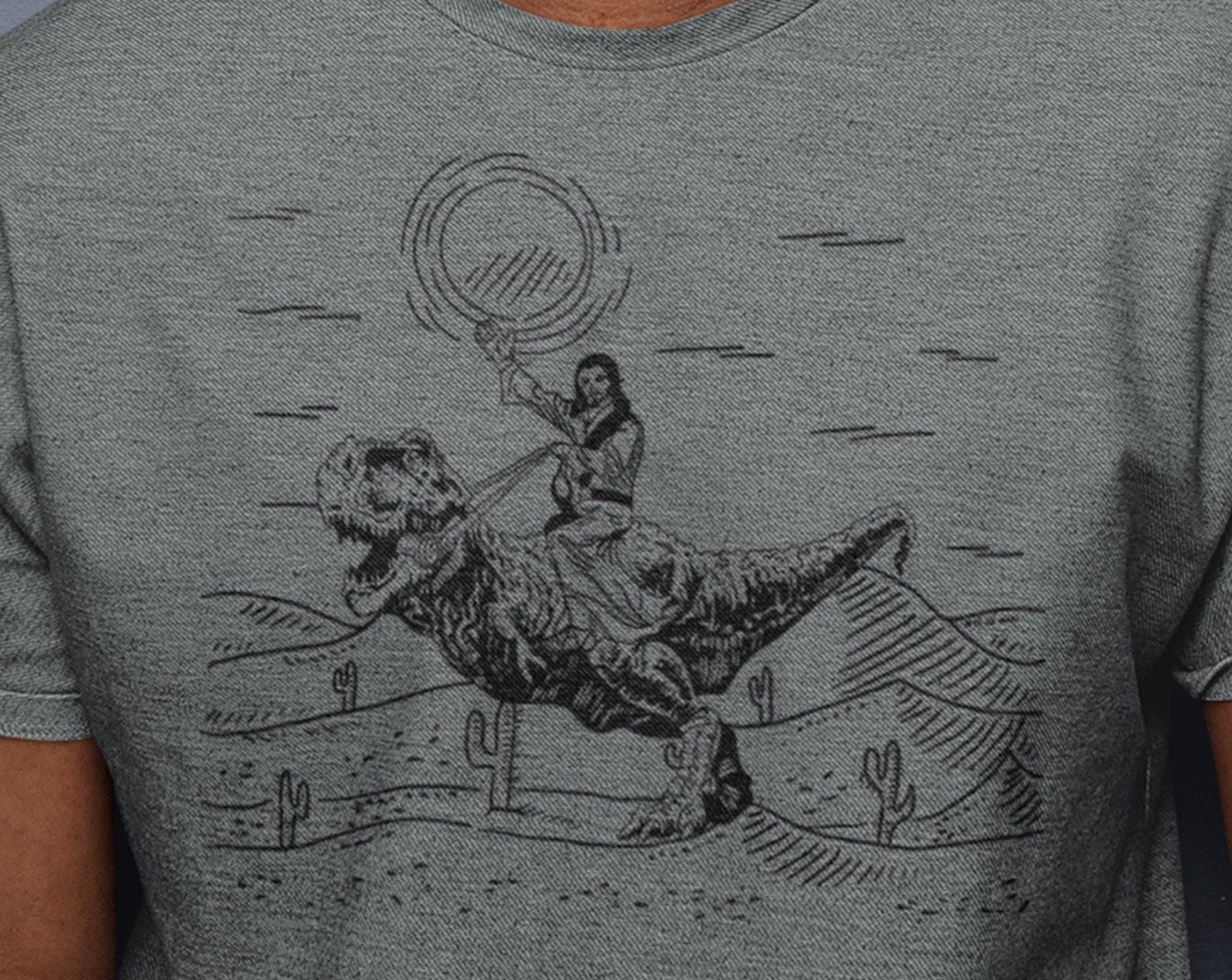 Jesus Riding Dinosaur T-Shirt, Funny Offensive Jesus Shirt, Cool Novelty Shirts, 90s Graphic Tee For Men Women Tee, Graphic Faith T-Rex Tee S