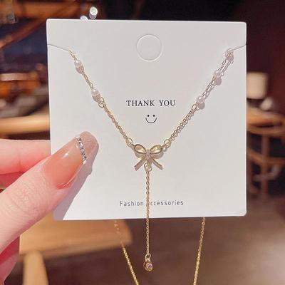 High-End Titanium Staal Boog Kwastje Ketting: Elegante, Super Fee Mode voor Vrouwen, Trendy Sleutelbeenketting