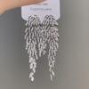 Silver Needle Luxury Zircon Leaf Tassel Earrings: Exquisite European Court Style