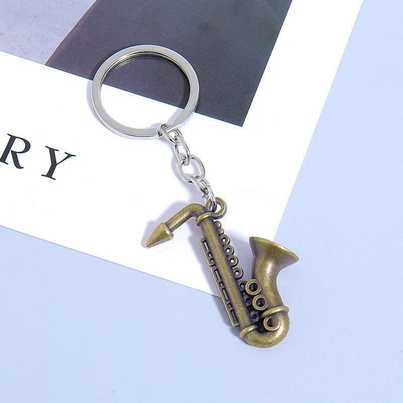 Mini nástroj Saxofon Přívěsek na klíče do auta Mini hudební nástroj Kovový kroužek na klíče Příslušenství Přívěsek na tašku Dárky na hudební festival