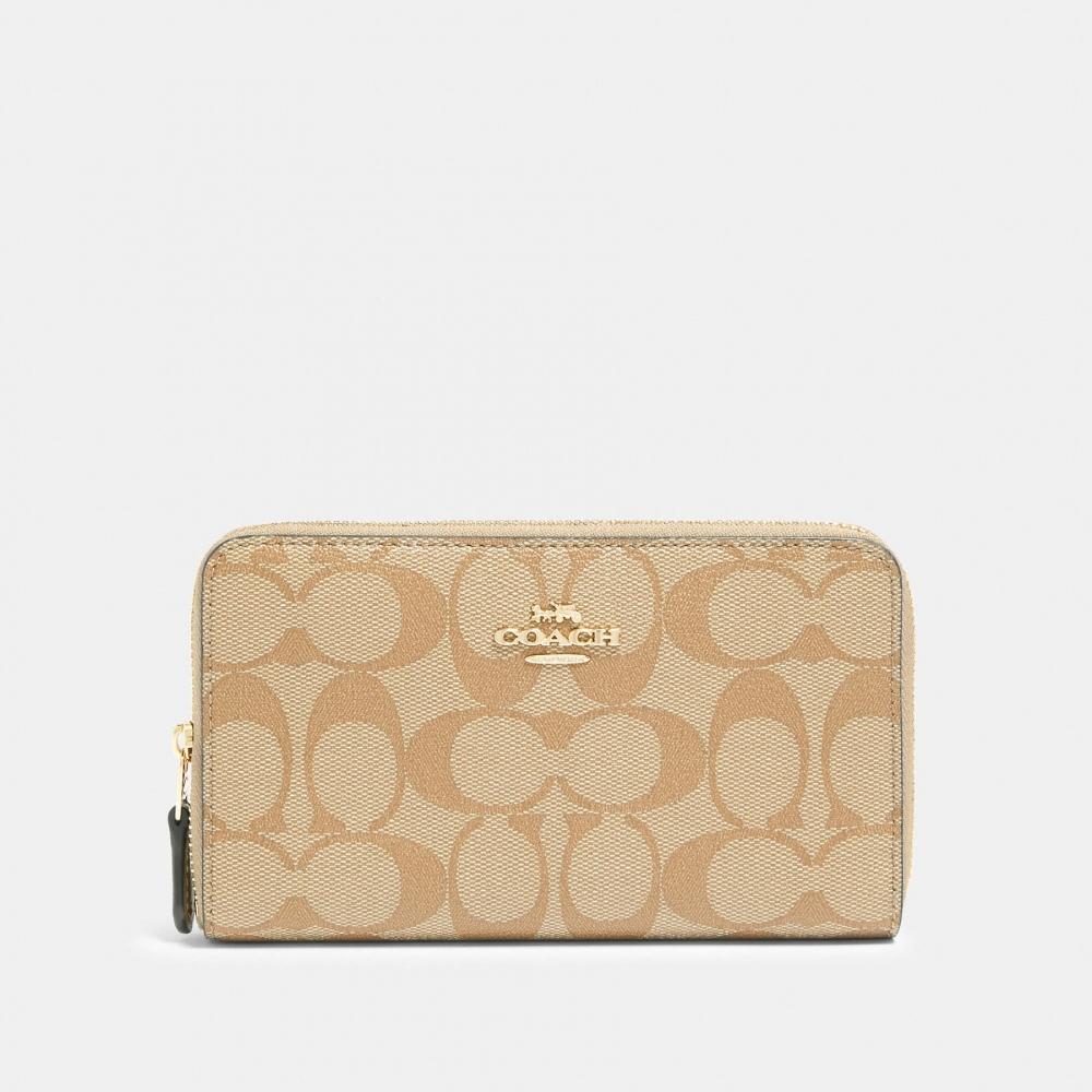 

Кошелек Coach среднего размера на молнии из канвы Signature