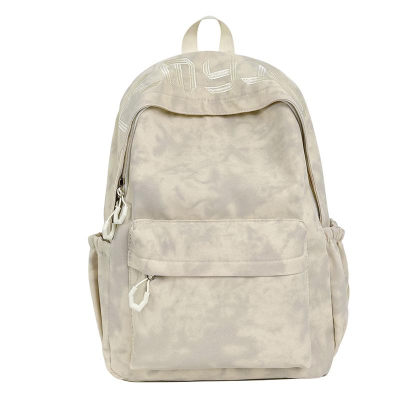 Schoolbag Japanese simple and versatile large-capacity solid color campus schoolbag 1011 summer new light commuter student backpack
