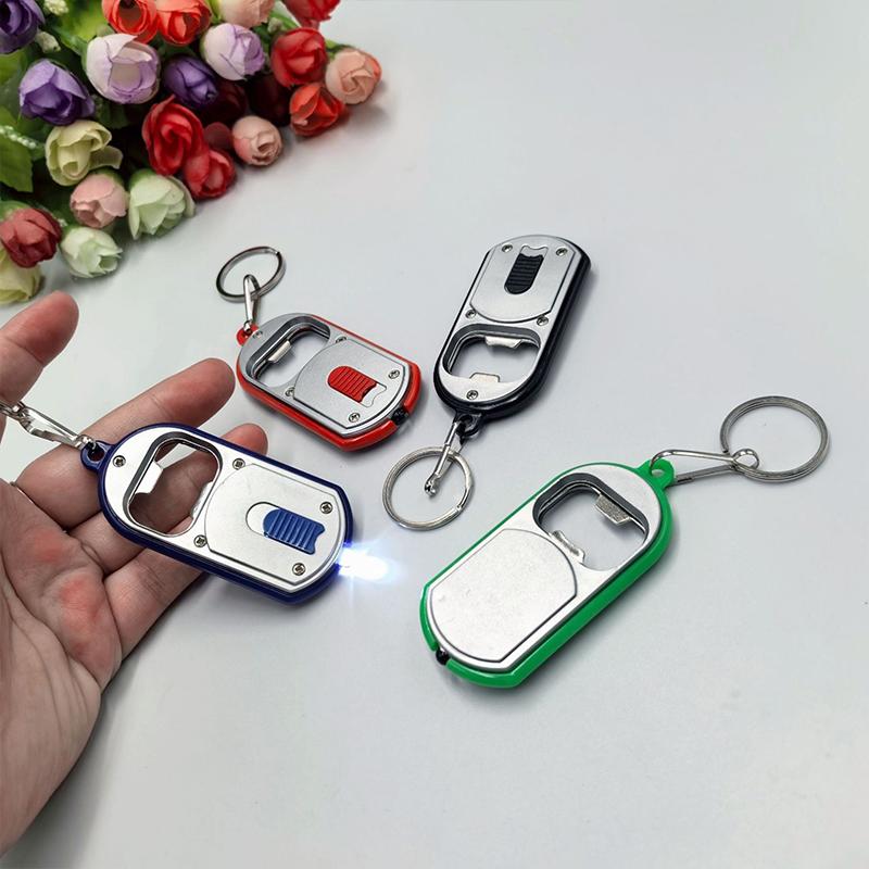 Ouvre-bouteille LED Multifonctionnel Mini Lampe de Poche Illuminée Porte-clés Pendentif