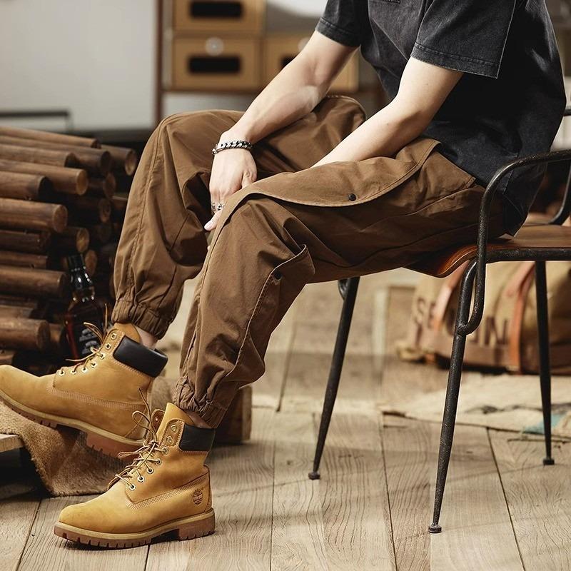 Large size casual pants, multi-pocket splicing button elastic overalls, men's tied-leg trousers