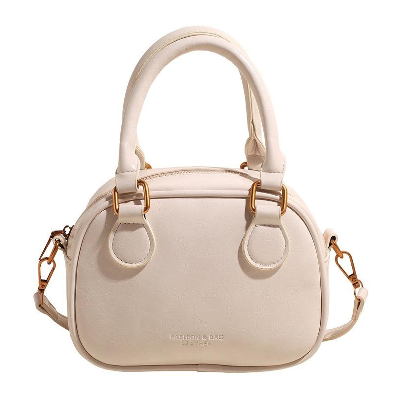 Temperament retro senior sense portable bowling bag versatile commuting niche casual simple wind messenger women's bag