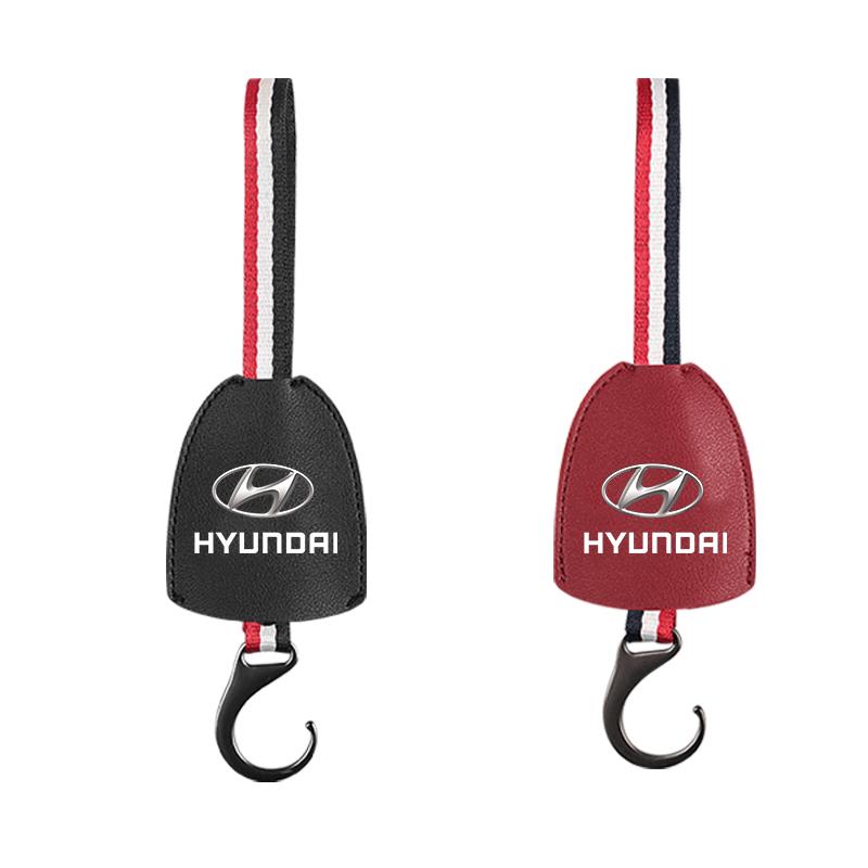 1Pcs PU Leather Car Seat Back Hooks Accessories For Hyundai I10 Elantra Getz Sonata XG Terracan Coupe Trajet Matrix Emblem AH4