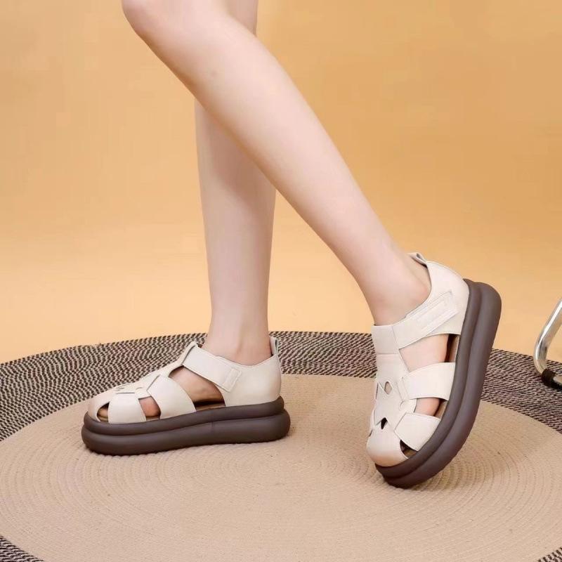 Real soft leather bag head Roman sandals women's 2025 summer new muffin bottom pig cage shoes thick sole light niche women cool