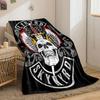 A skull with flaming wings and a sword, framed by intricate patterns. for all seasons blanket lunch break throw gift