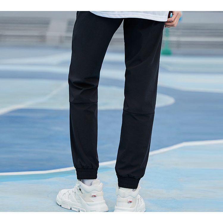 Li Ning Sports Basketball Series Tapered Woven Long Pants Knitted Sports Pants Men pants Black AYKQ219-2
