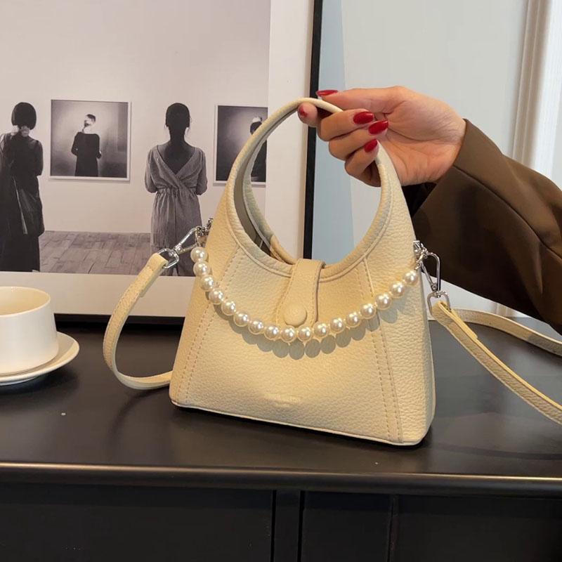 Mode Enfärgad Design PU Väska Högkvalitativ Känsla Pärlkedjor Bärbar Liten Hinkväska Dam Koreansk Version Pendlarhandväska