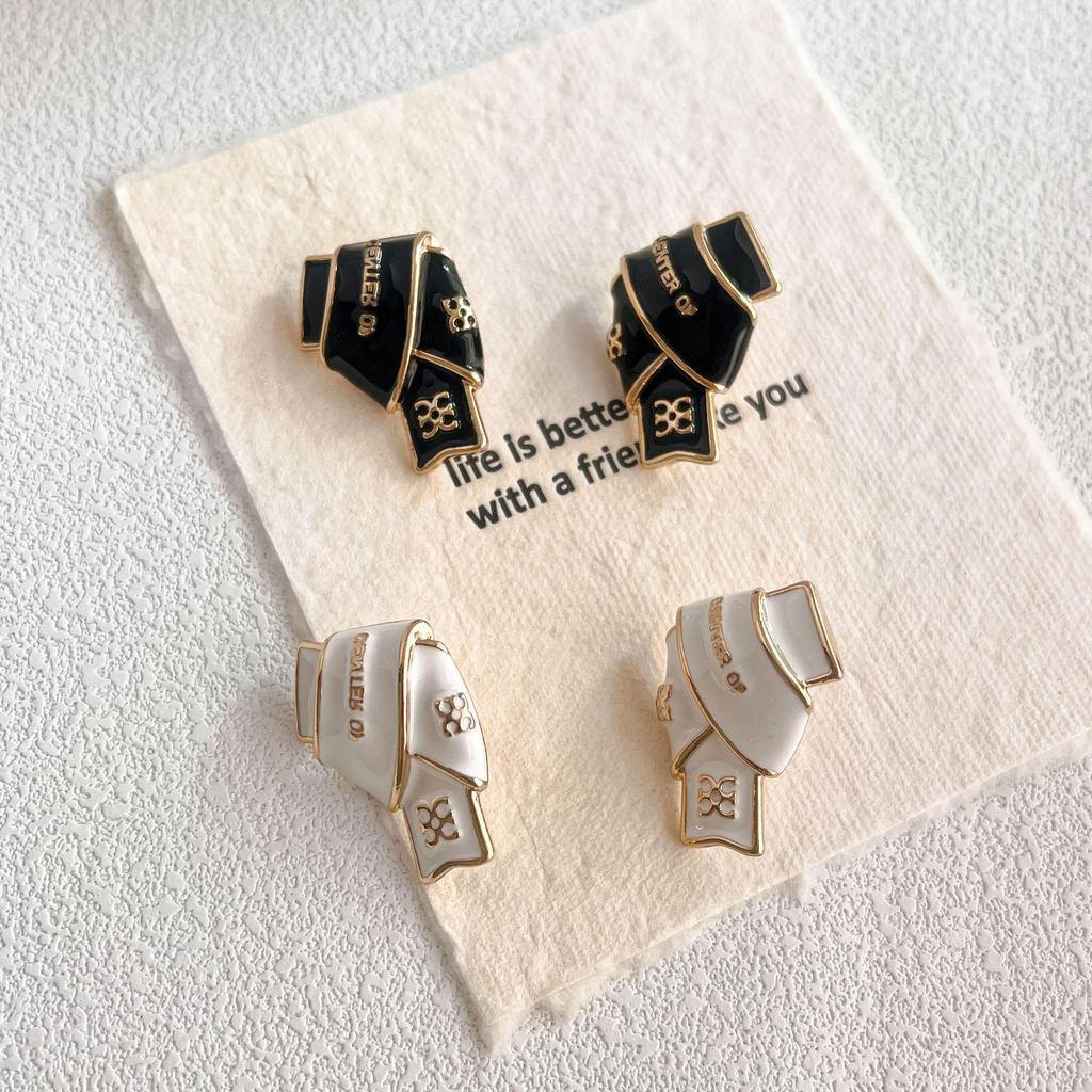 Black & Gold Enamel Twist Earrings: Versatile Luxury Studs for Autumn/Winter 2025