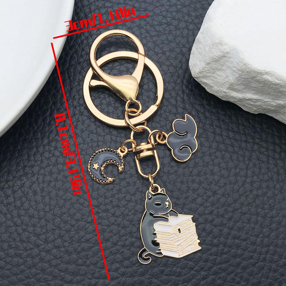 Well-Behaved Black Cat Zinc Alloy Keychain: Cute Drip Oil Cartoon Pendant for Backpacks