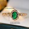A ring inlaid with egg-shaped green synthetic zirconia, featuring a lace design, is elegant, simple, classic, exquisite, fashionable, luxurious, and