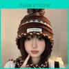 Cozy Knitted Chic Winter Hat For Women Featuring Colorful Pom Poms And Warmth