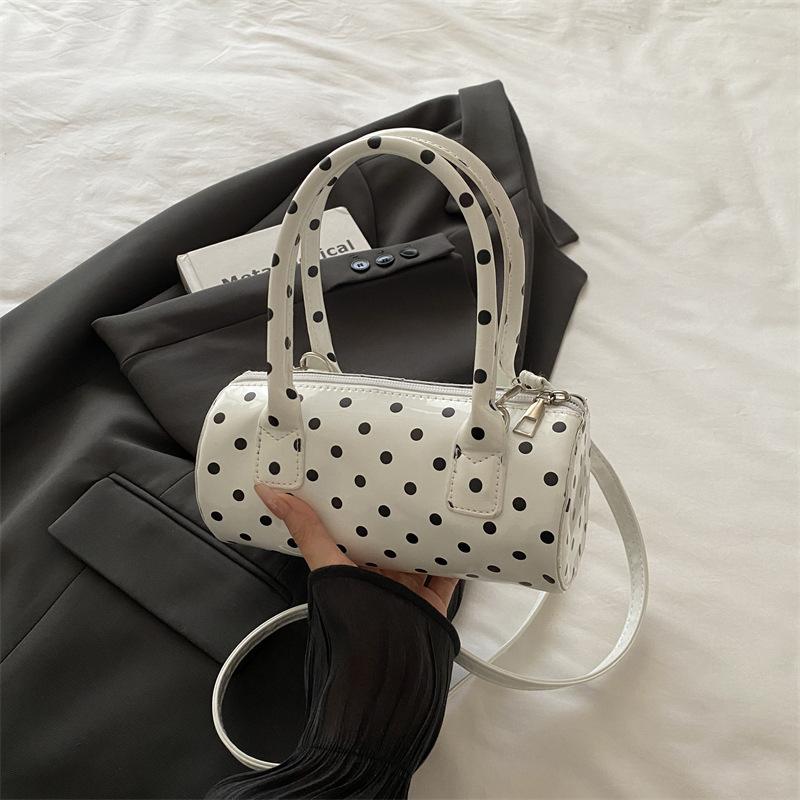 Niche polka dot bag women's 2025 bag new French retro underarm messenger bag exquisite portable women's bag cylindrical bag