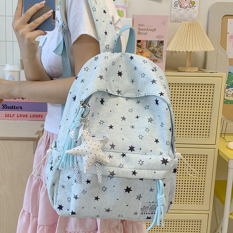 Star-Printed Backpack with Front Zipper Pocket and Tassel Details for School and Daily Use