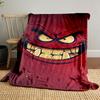 A menacing red face with sharp teeth, angry eyes, and bold expressions. for all seasons blanket lunch break throw gift