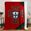 A red background with a central badge featuring a shield and cross design. for all seasons blanket lunch break throw gift