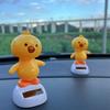 Adorable Cartoon Chick Car Ornament. A Cheerful, Nodding Decor Piece for Your Car and Home Interior.