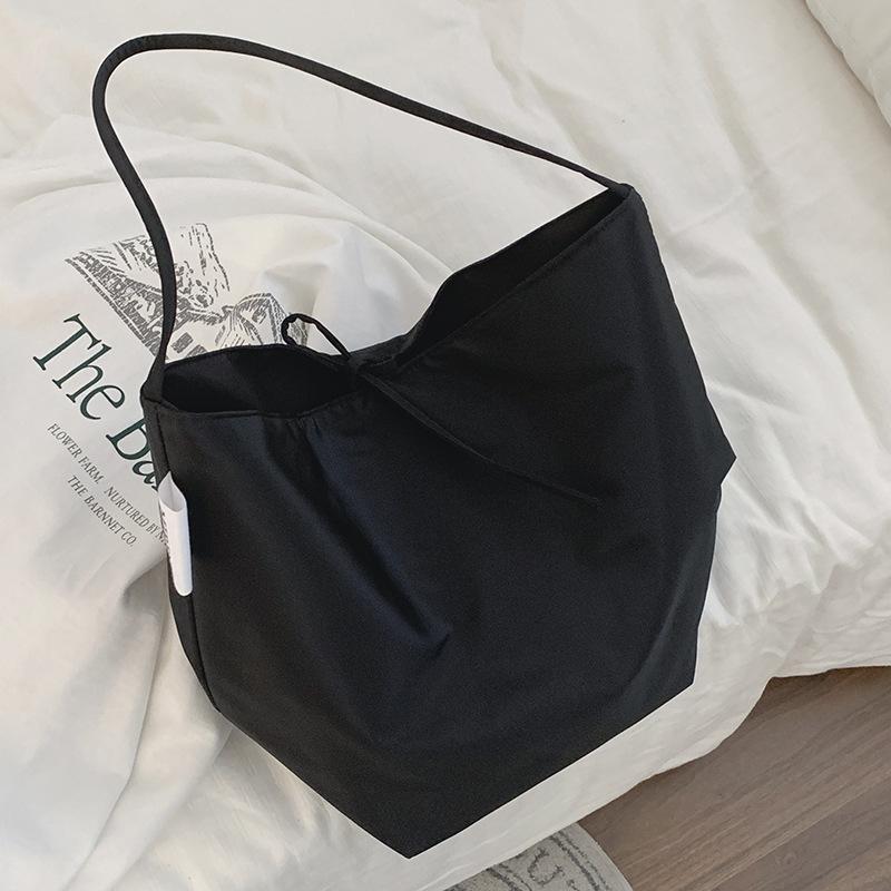 Casual large-capacity bag women's 2025 simple canvas bag versatile one-shoulder armpit bag student class bag handheld