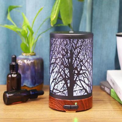 Iron Art Aromatherapy Diffuser: Silent Humidifier with Colorful Night Light and Wood Grain Finish for Yoga and Home Relaxation.
