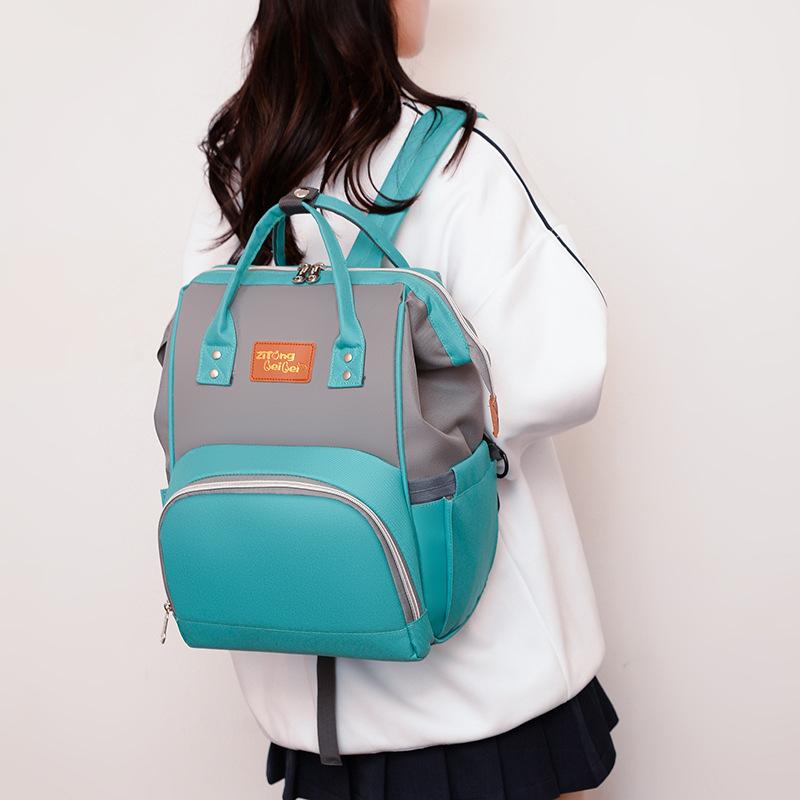 Schoolbag mommy bag 1011 new Korean version multi-functional fashion canvas color scheme backpack women's bag baby bottle bag