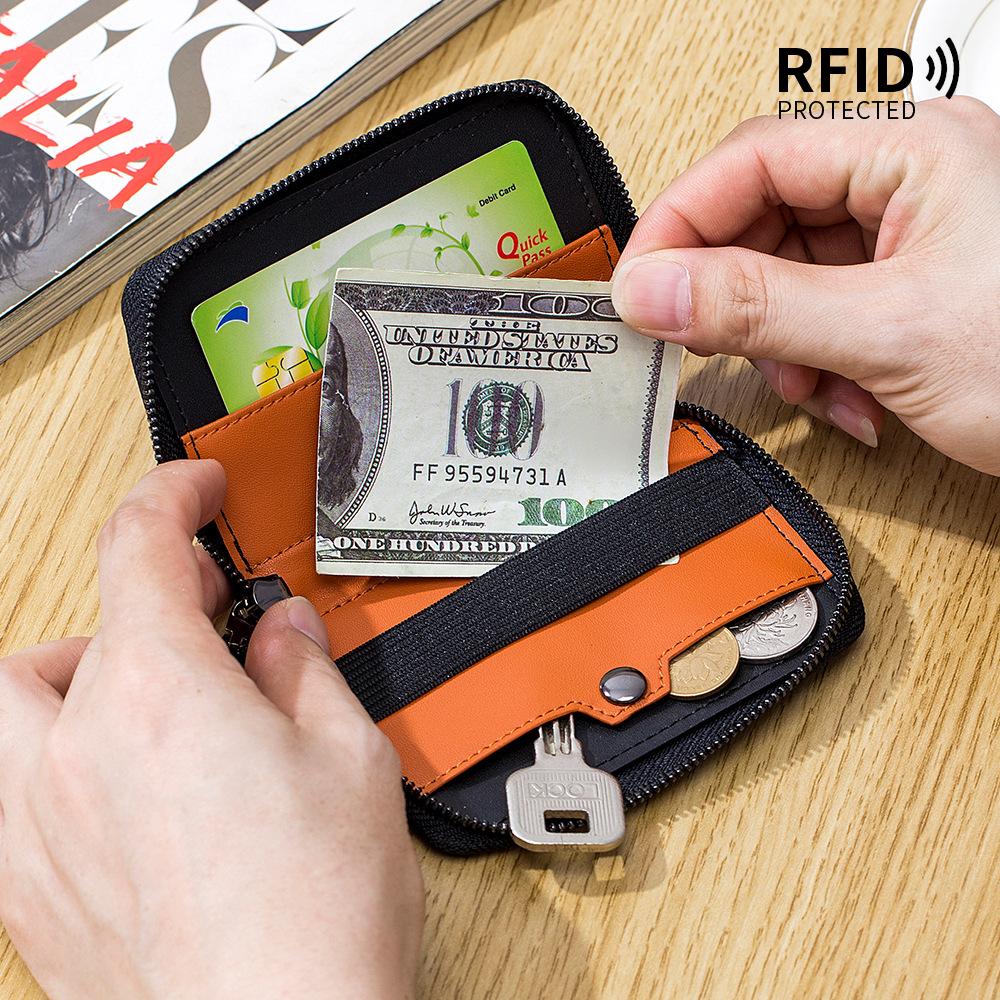 The First Layer of Cowhide Retro Men's Short Change Bag, European and American Vertical Dollar Clip, RFID Multi-card Pumping Card Bag.