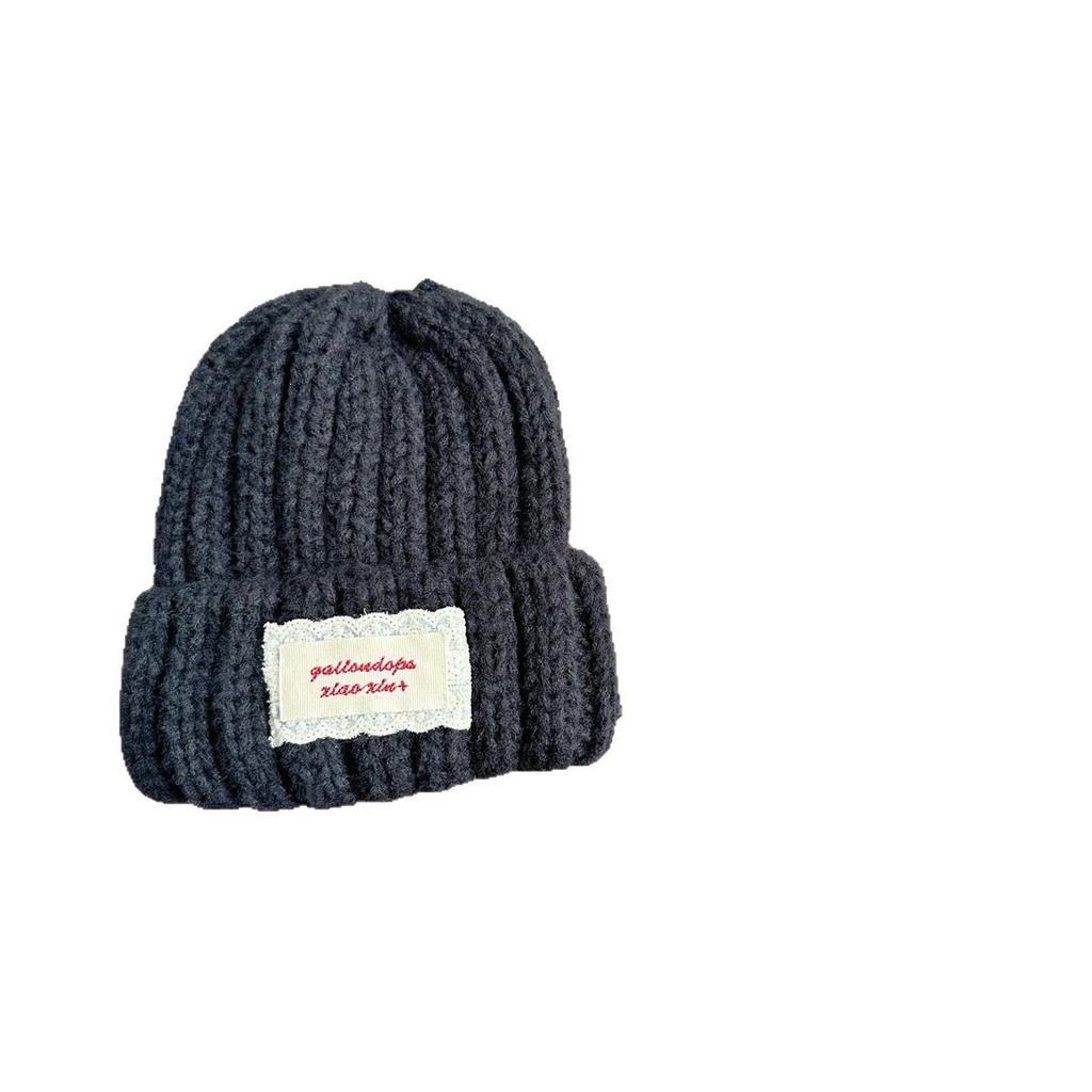 Neue Spitze Etikett Kinder Wollmütze Nuojiji Student Herbst und Winter Neu Warm und Vielseitig Ohrenschutz Strickmütze
