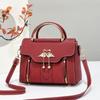 The Lady Is Carrying A Sweet Single-shoulder Bag with A Large Capacity for Daily Commuting, A Crossbody Bag.