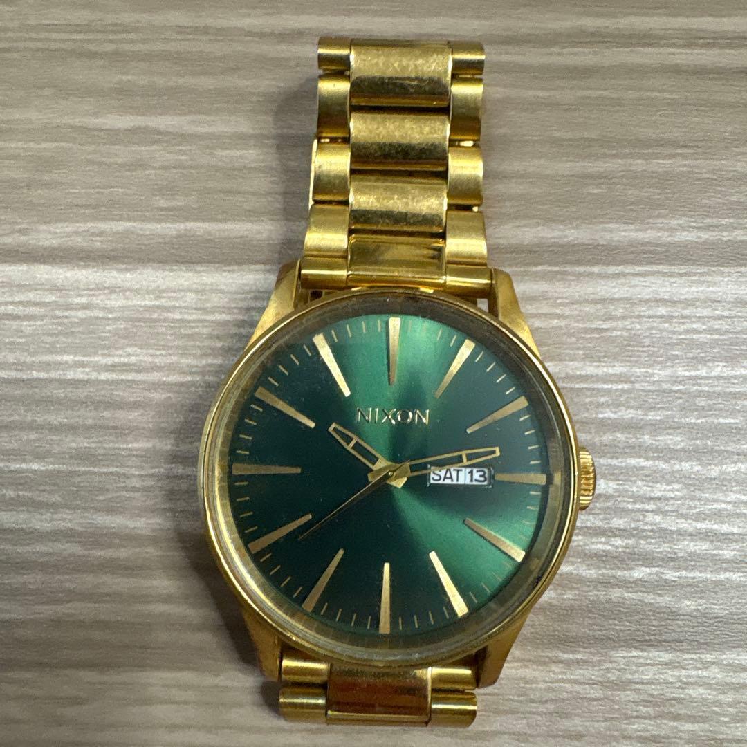 Used NIXON watch gold green dial