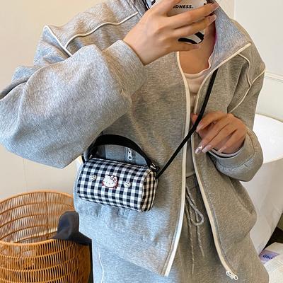 Nieuwe hoogwaardige en schattige draagbare messenger damestas, geruit contrasterende kleur mond rode envelop, buitenlandse stijl, lichte en modieuze schoudertas
