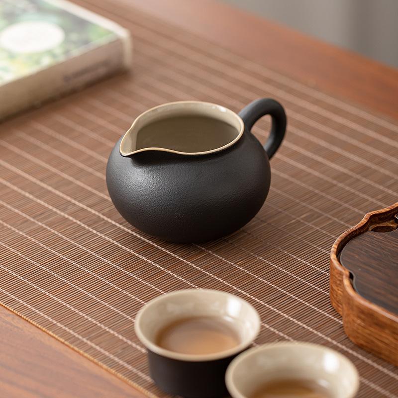 Japanese-style black pottery fair cup kung fu tea set accessories male cup tea leak set simple ceramic tea sea hand grab tea set