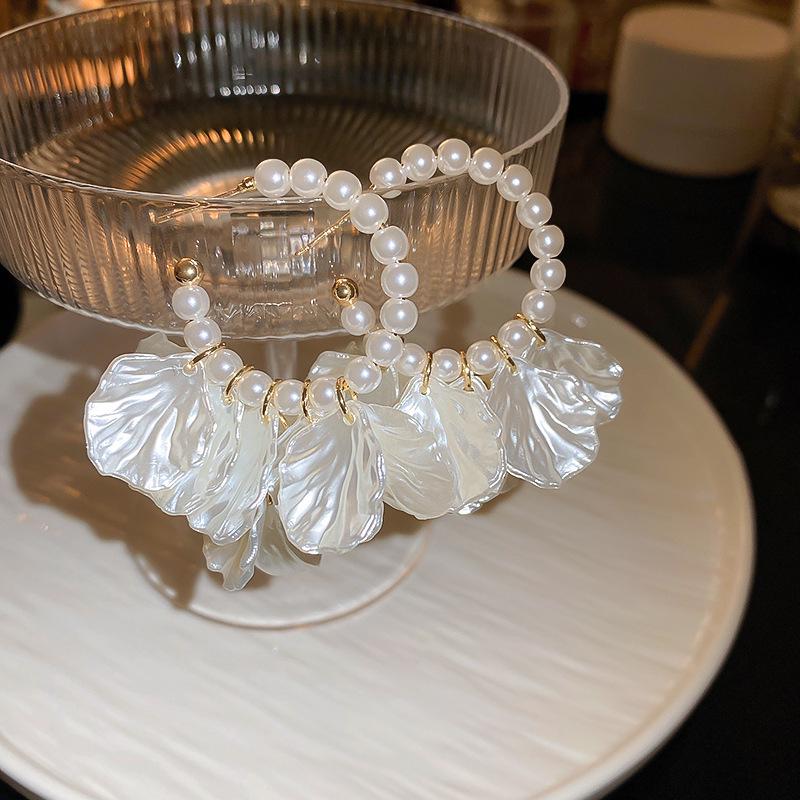 Silver Needle White Heart Tassel Earrings: Luxurious, Versatile, and Stylish Stud Earrings for Women.