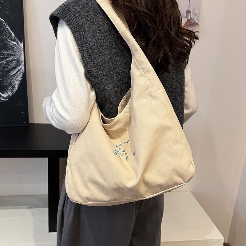 Large capacity bag women's autumn leisure 2025 new simple shoulder canvas bag fashion sense niche commuter tote bag