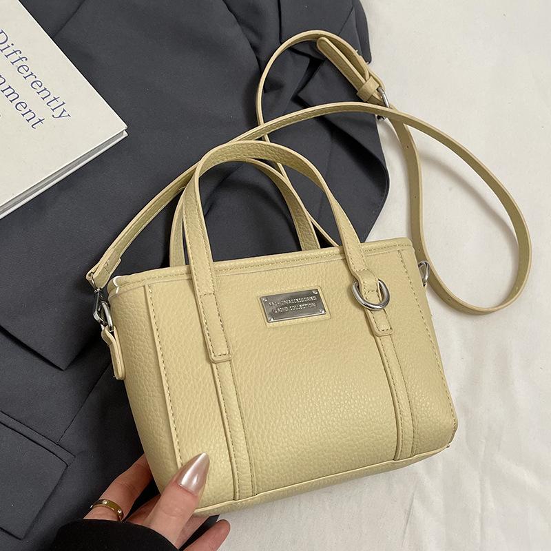 Spring hot sale lychee pattern high-end portable bucket bag Korean version casual small fresh temperament versatile messenger women's bag