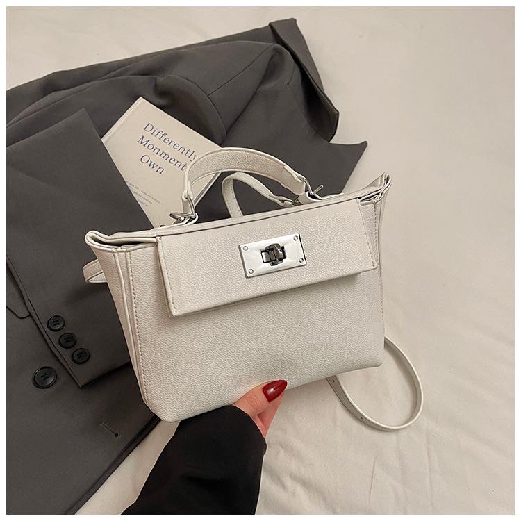 

Textured soft leather handbag bag women s 2025 new niche design Kelly bag commuter large-capacity one-shoulder crossbody bag белый