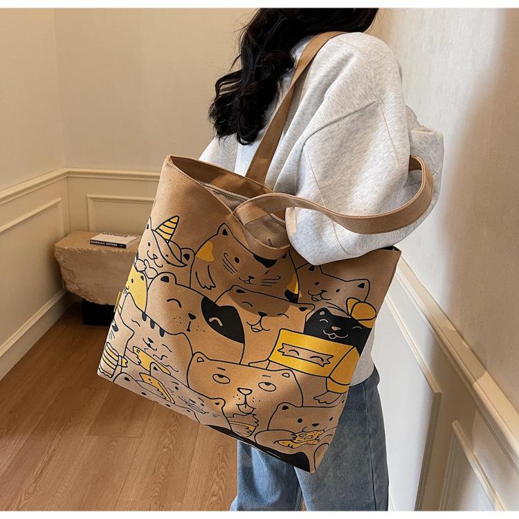 Tote bag women's new cartoon hand-held cloth bag large-capacity student commuting shoulder canvas bag