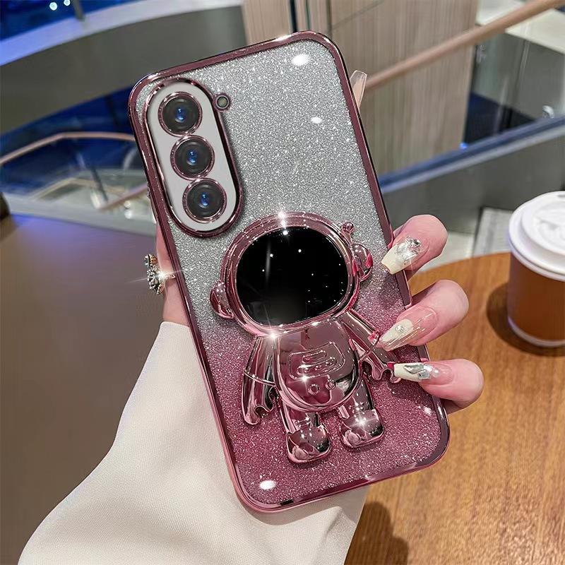 

Astronaut Stand Suitable for Samsung S24ultra Mobile Phone Case S23Plus Gradient Flash Powder S22 Astronaut S22 ULTRA