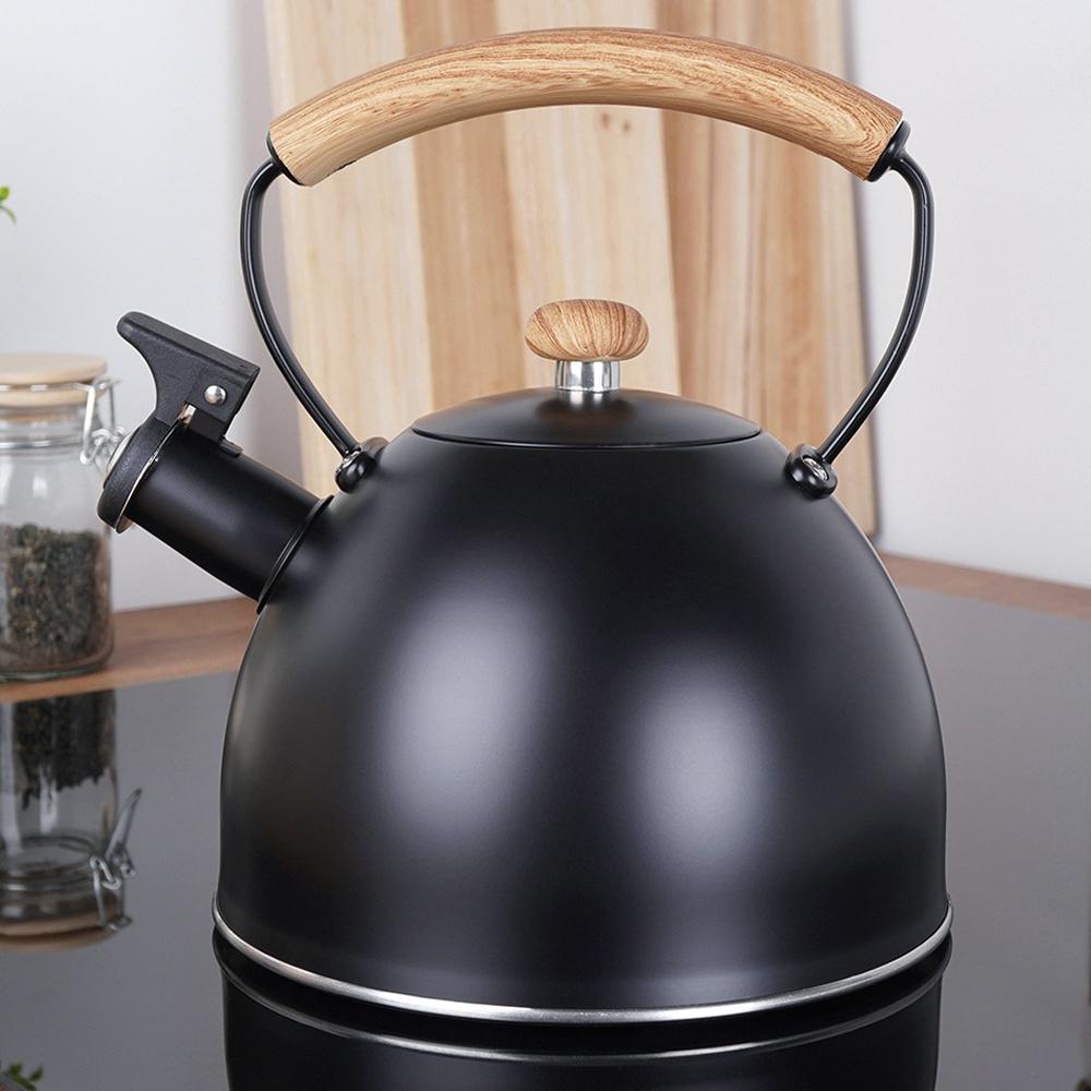 Black Steel Kettle with Whistle for Boiling Water on the Stove