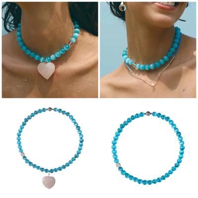Collier élégant avec perles en pierre œil de chat bleu en forme de cœur d'amour, symbolisant l'amour et la tendresse pour les femmes tendance, à porter au quotidien.
