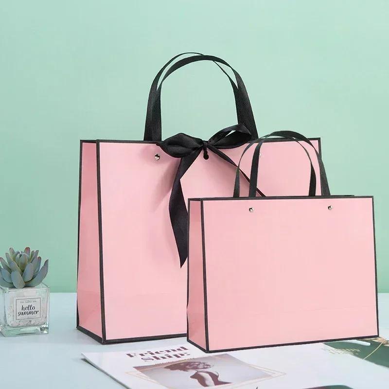 White Paper Jam Handbag Kraft Paper Thick Waterproof Frame Rivet Handle Gift Bag Cosmetic Clothing Store Portable Packaging Bags